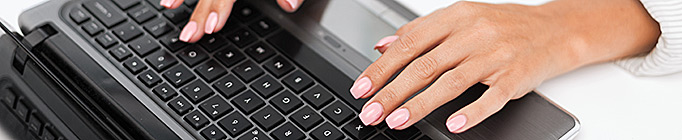 Woman typing on her laptop computer